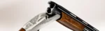 Benelli 828 S Silver A.I. 12 Kalibre süperpoze av tüfeği, gümüş işlemeli baskül detayları.